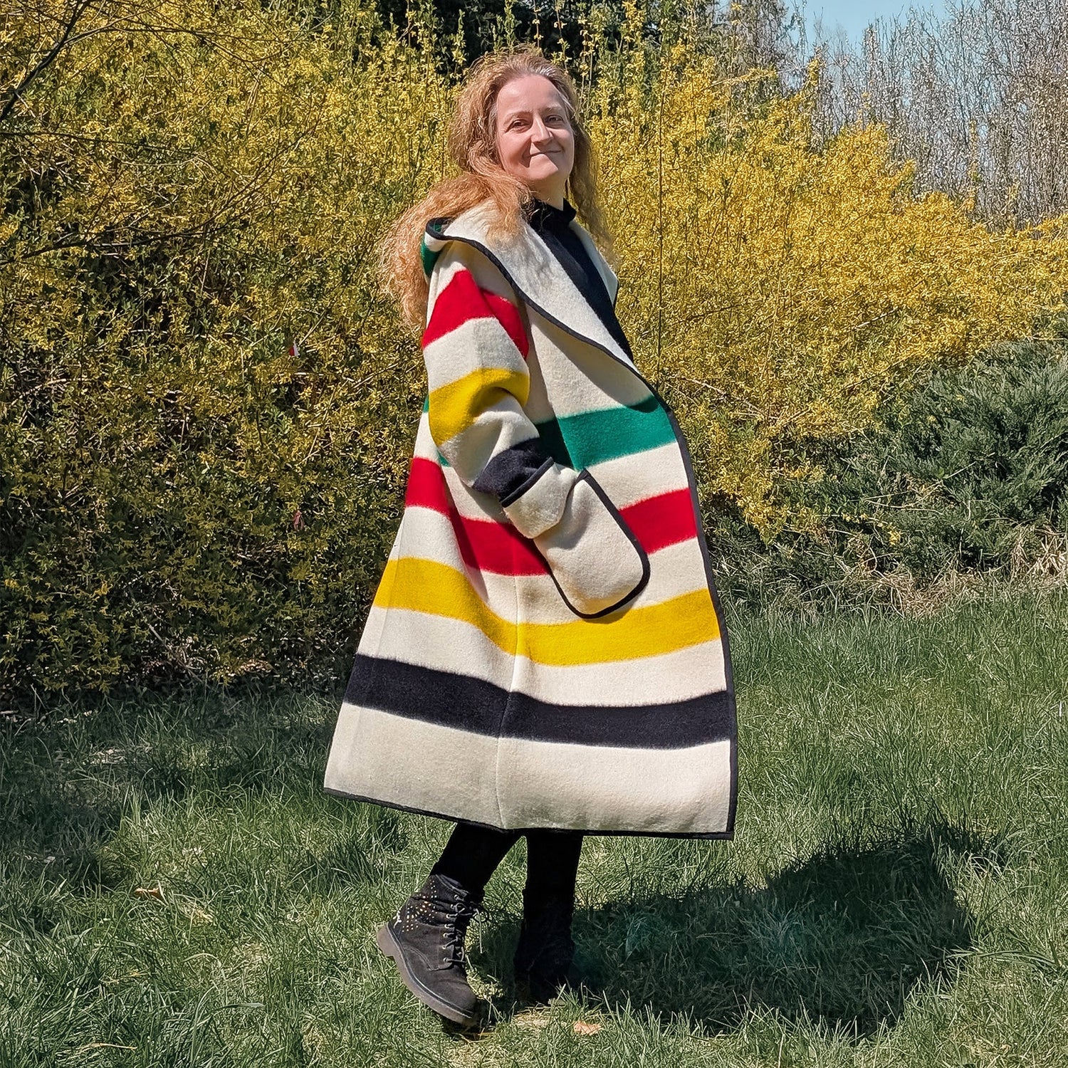 Woman wearing capote coat upcycled from wool blanket.