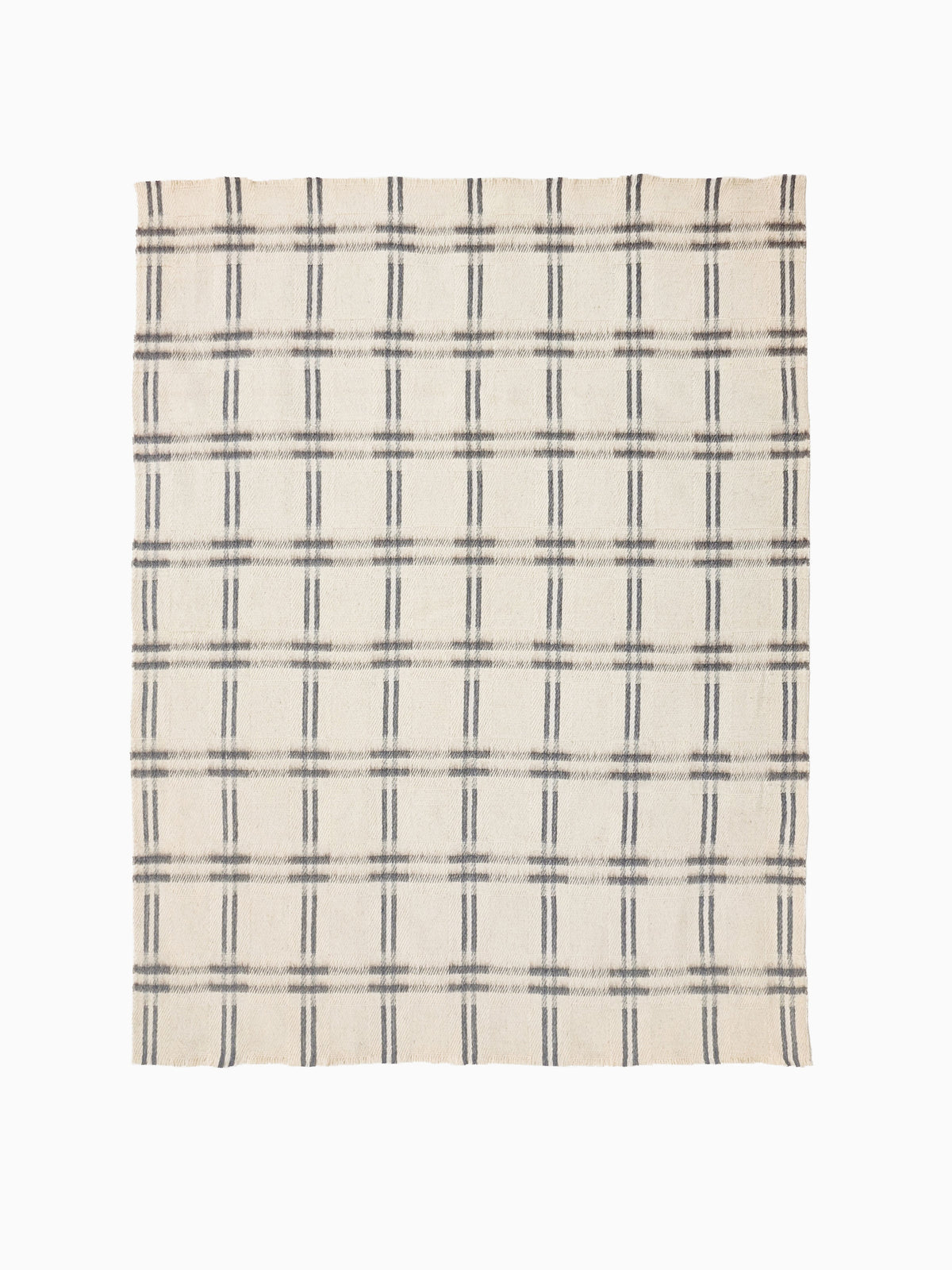 Full view of handwoven undyed wool blanket in natural ivory and taupe with geometric check weave