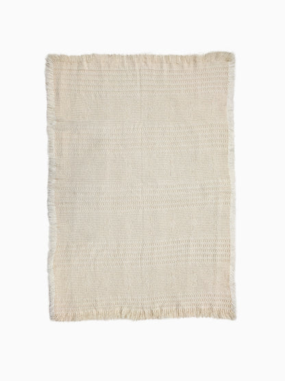 Undyed wool throw from pure wool with  structured weave detail and fringes
