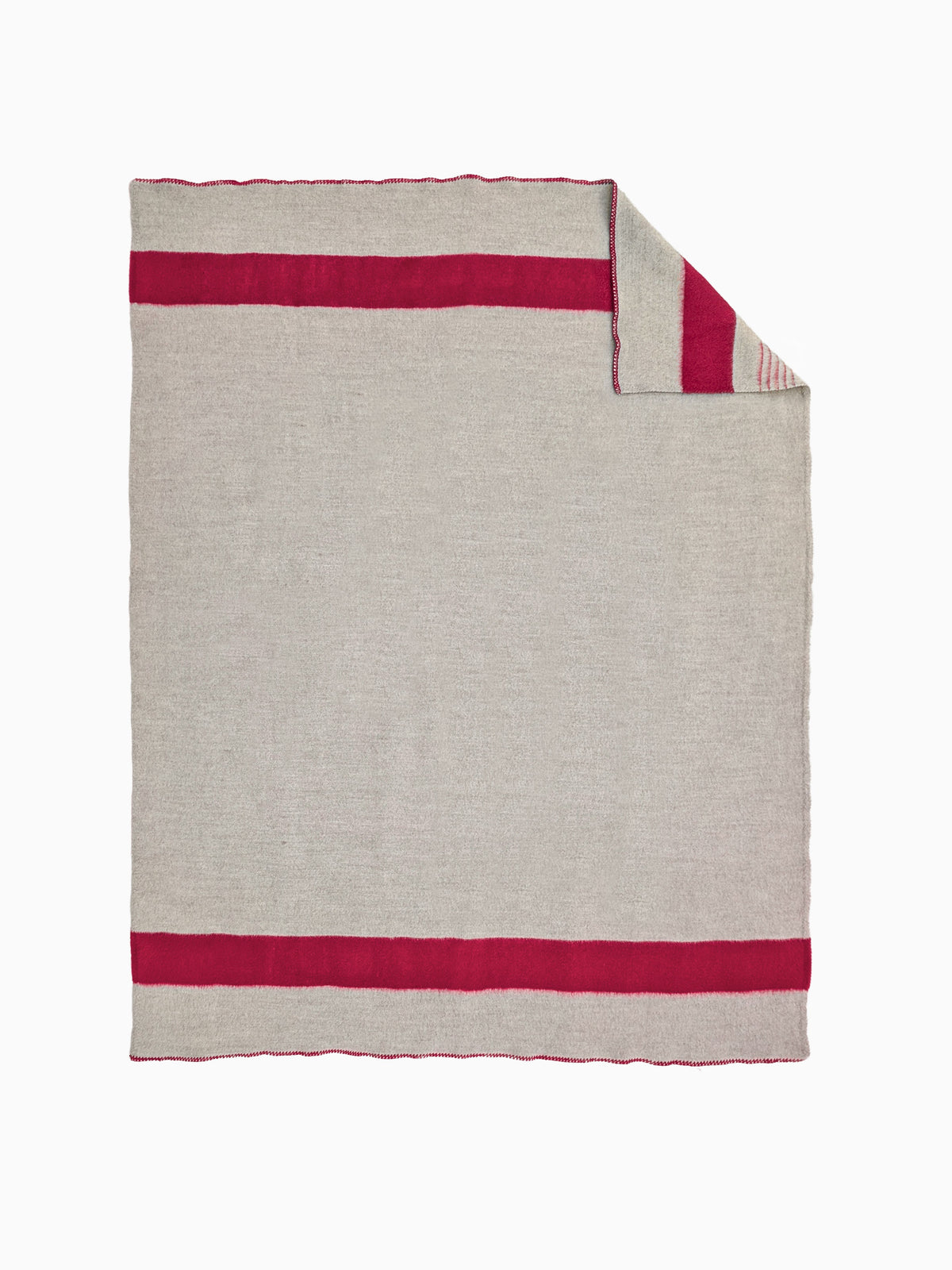 A light gray hand woven wool blanket with two bold horizontal magenta-red stripes, shown flat, with one corner folded over.