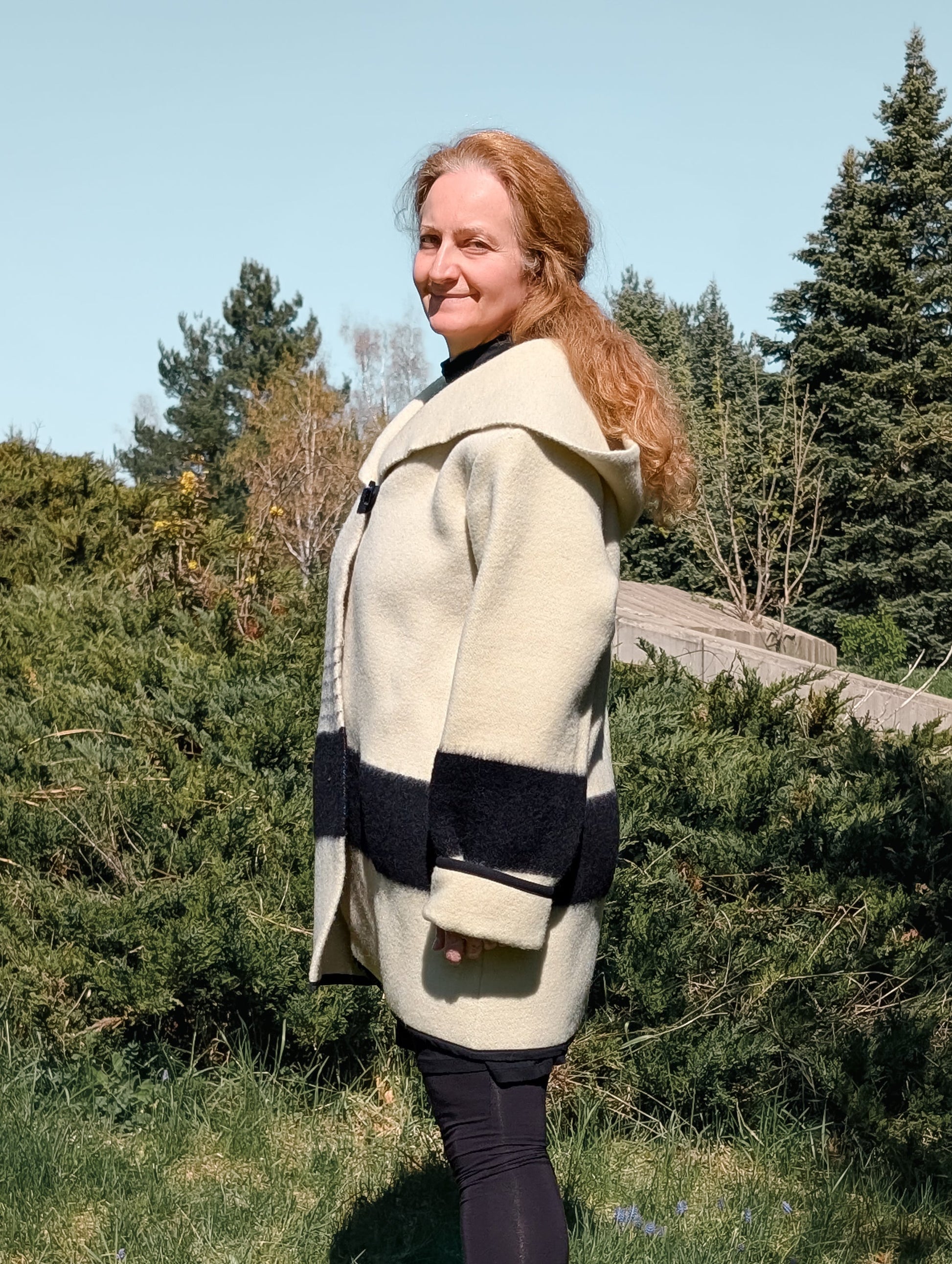 Woman wearing swing wool coat, handmade capote coat, repurposed from pure wool  blanket.