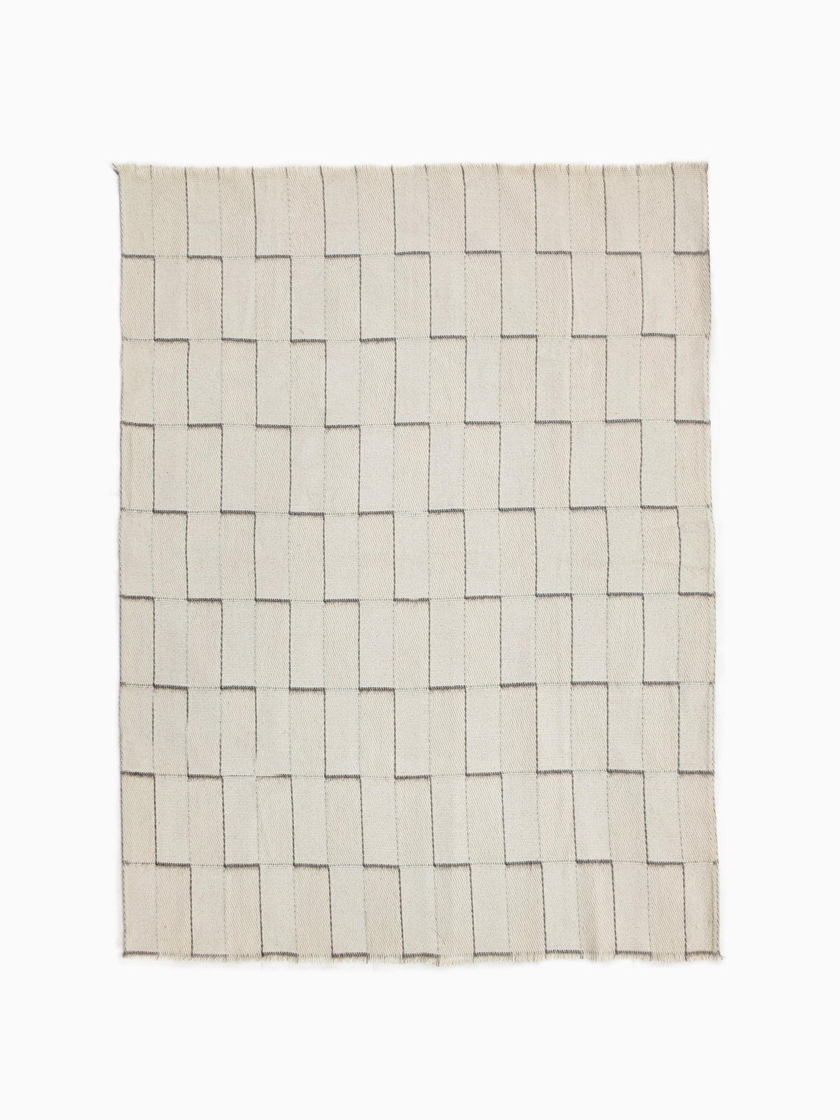 Full view of undyed pure wool blanket with handwoven stepped geometric pattern in natural ivory