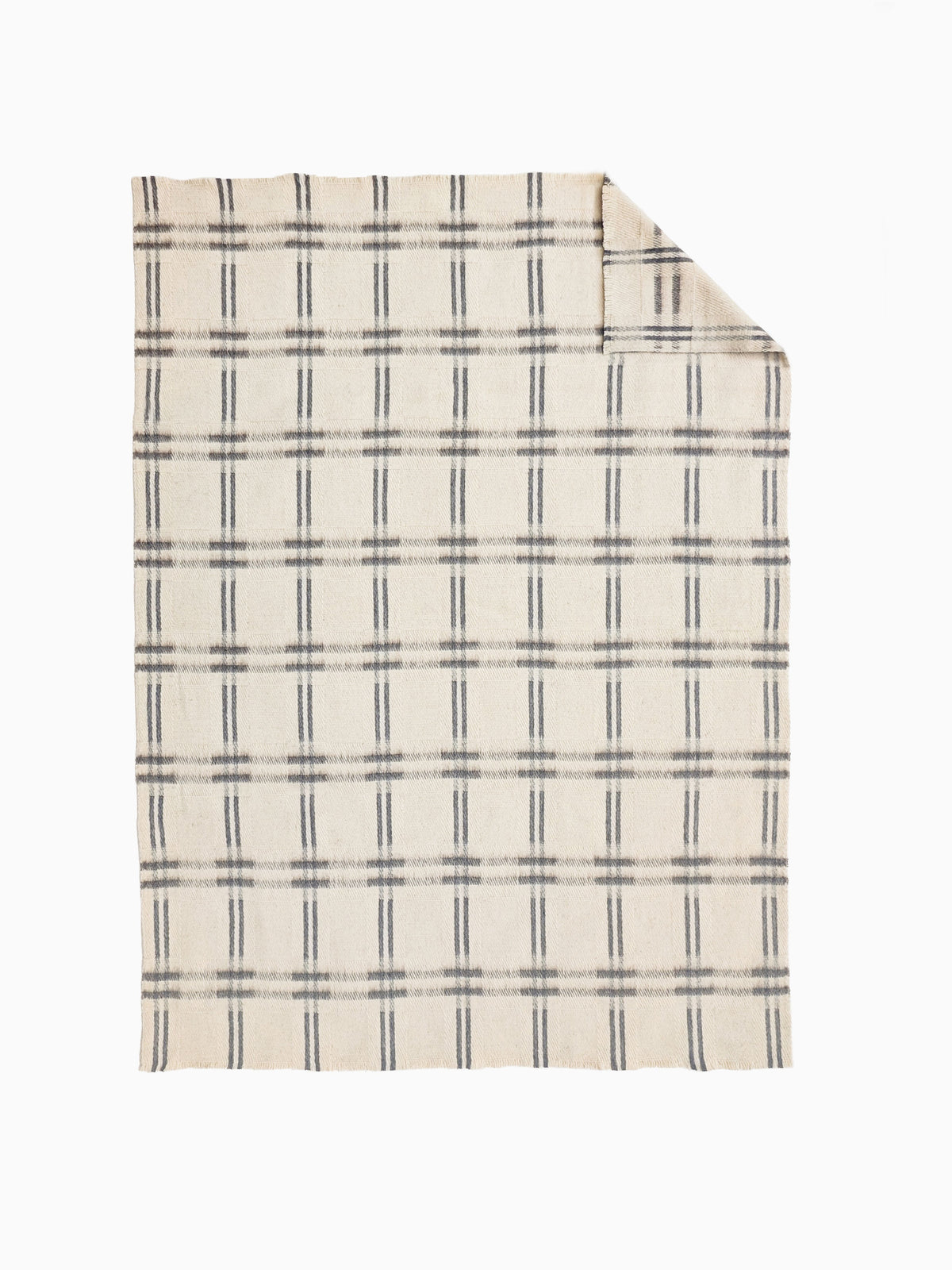 Undyed pure wool throw with handwoven ivory and taupe check. Heavywaight, breathable and hypoallergenic.
