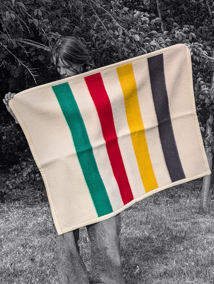 A girl holding a Soft Baby Blanket made from upcycled Lambswool Crib Blanket, B/W photo