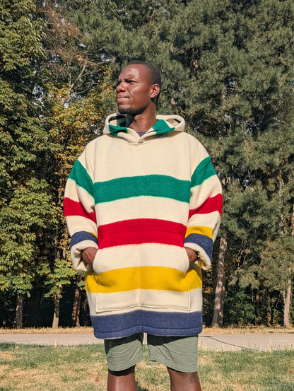 Man wearing a cool modern unisex hooded blanket hoodie with a cangaroo front pocket.