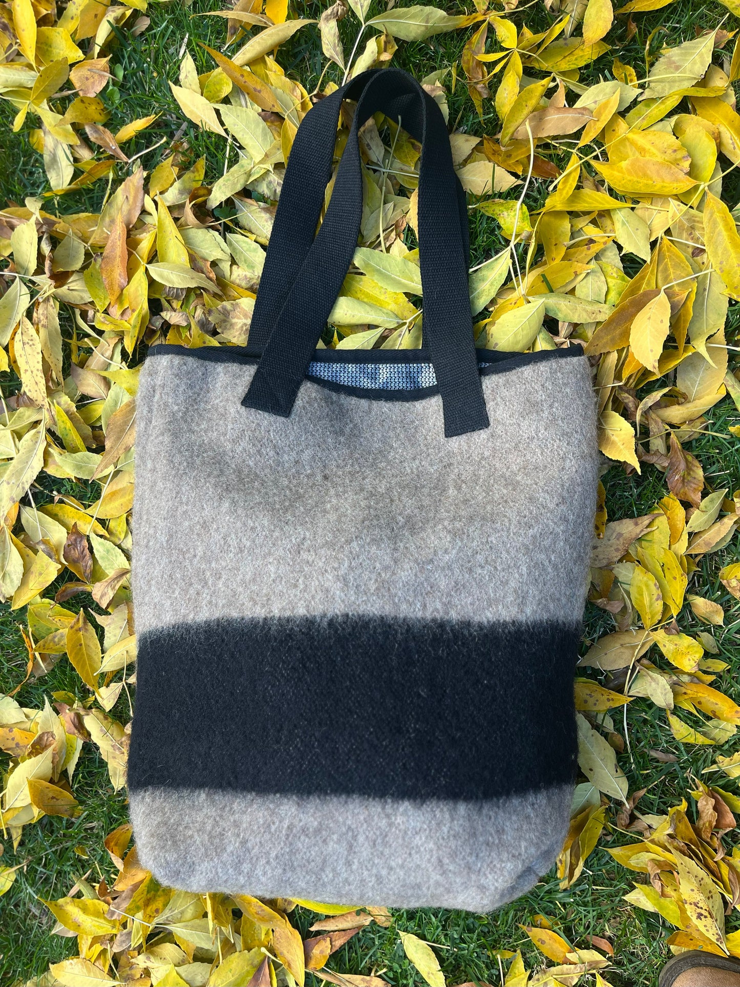 Gray tote bag with a signature black stripe, made from upcycled eco sustainable wool blanket.