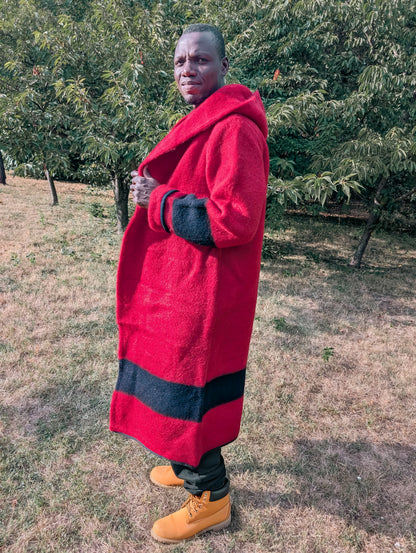 Man wearing long statement unisex hooded overcoat, upcycled from pure wool blanket. Suitable for reenactment. Worn loose or wrapped.
