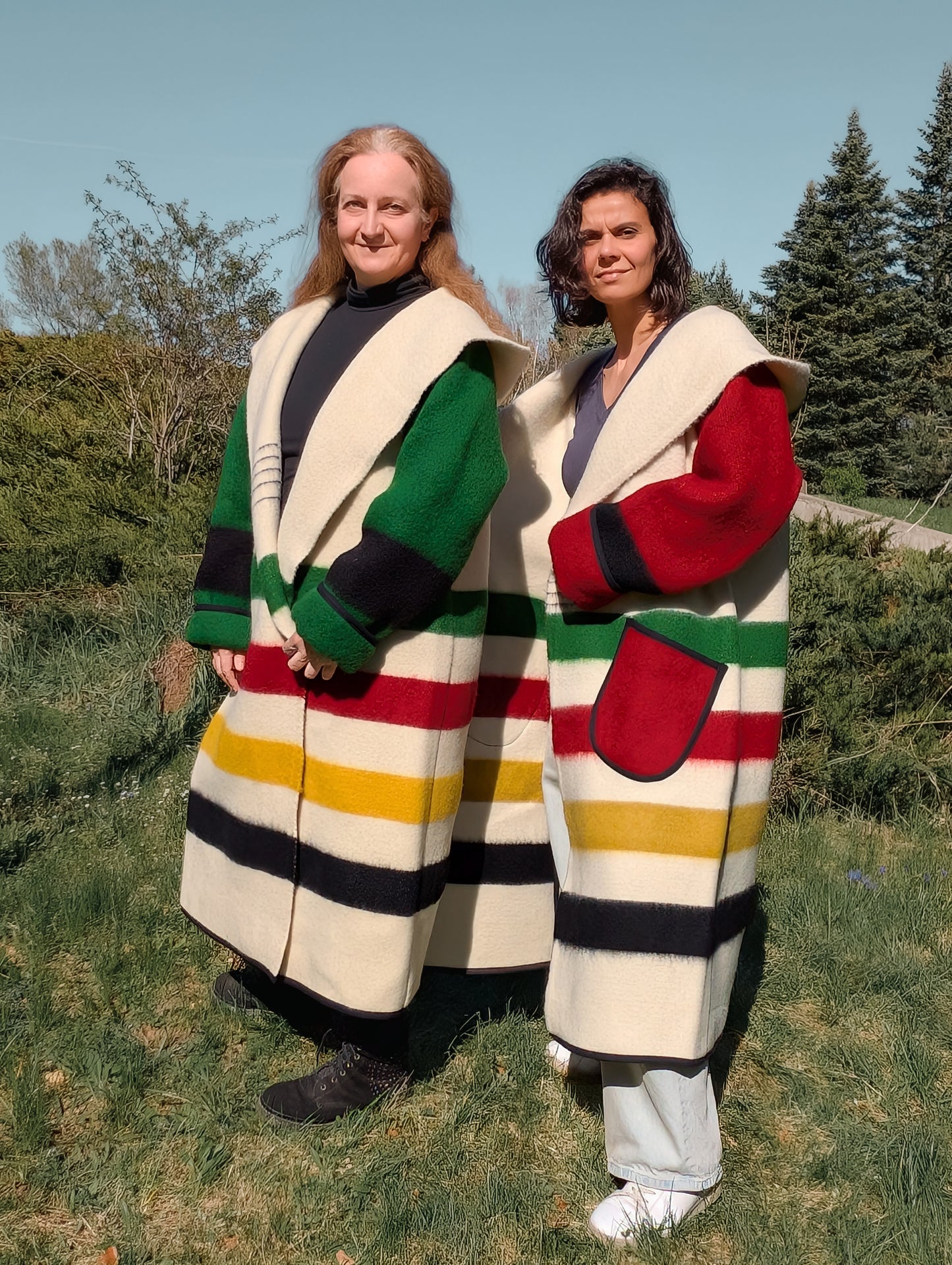 Two people wearing unisex stripe capotes, native american indians' style for reenactment and everyday wear.