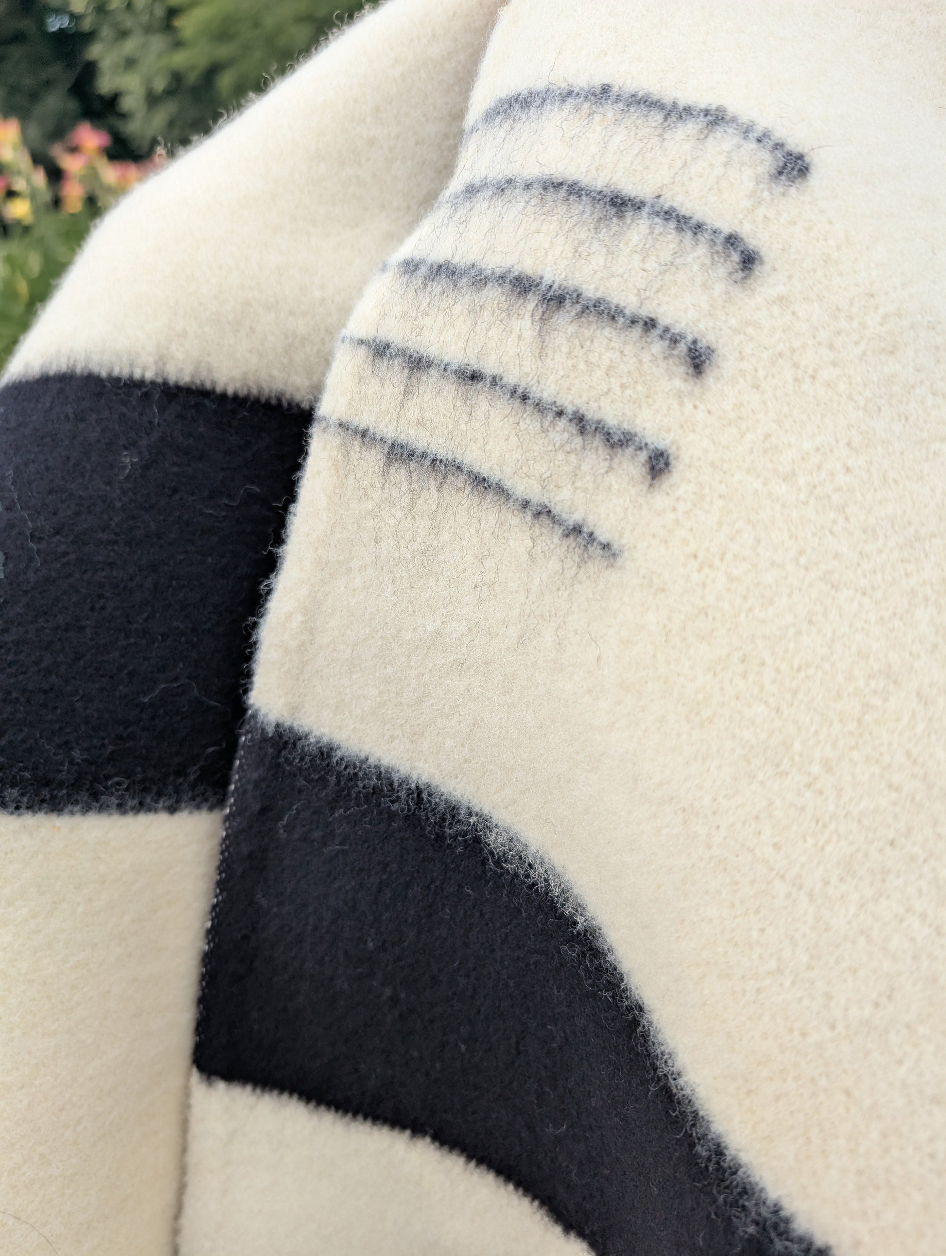A closeup of an iconic white native frontier wool blanket, handwoven from pure wool