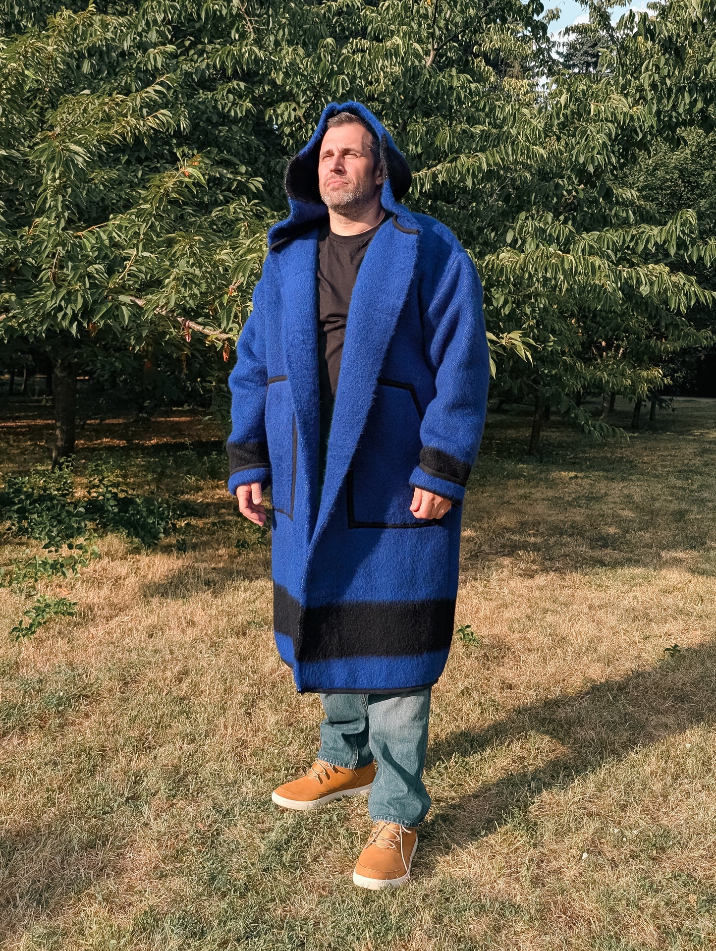 Man wearing a unisex long blanket coat, best for everyday wear and reenactment events. 