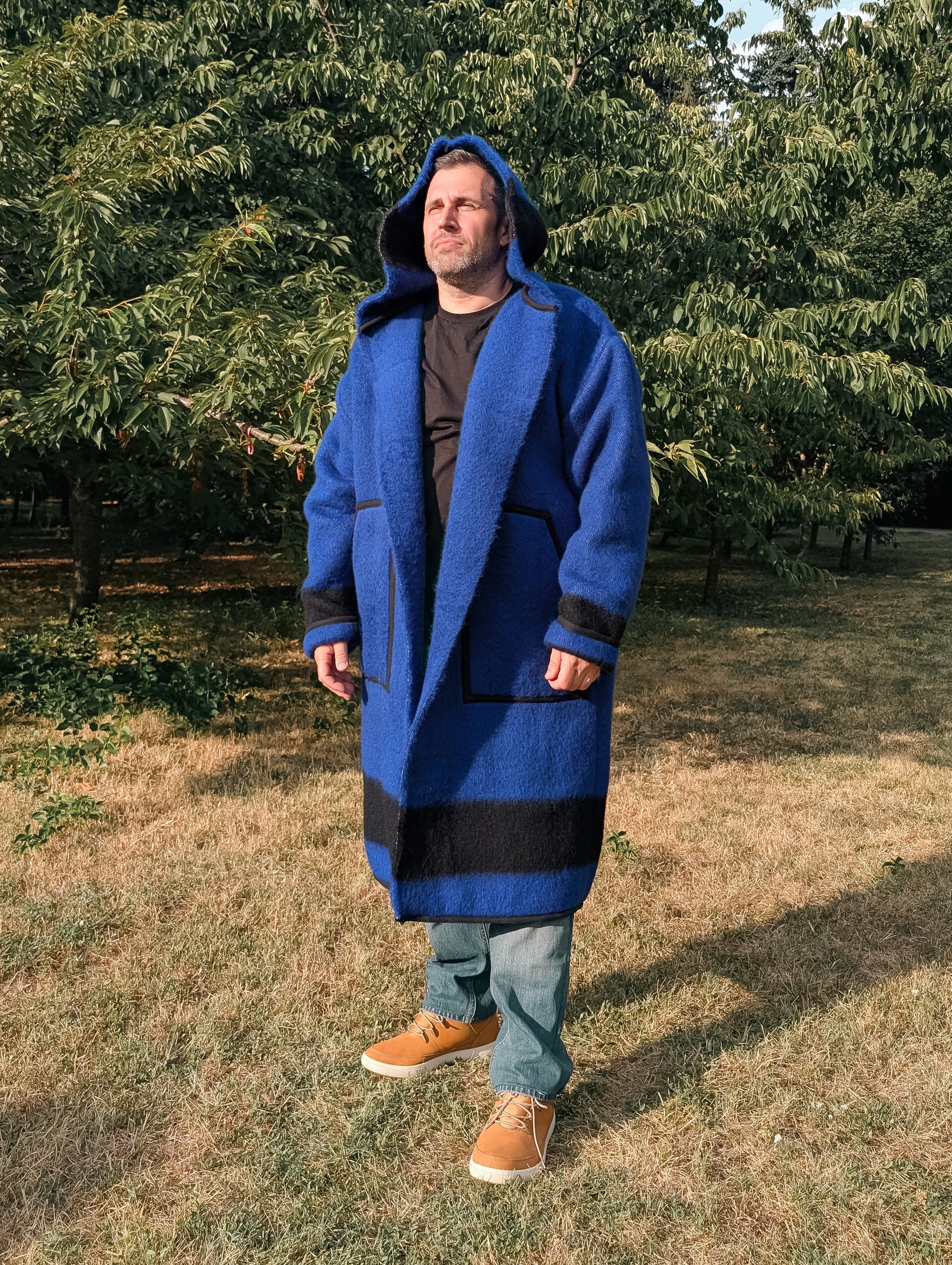 Man wearing a unisex long blanket coat, best for everyday wear and reenactment events. 