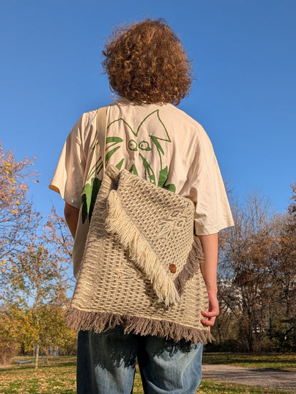 Man wearing cross shoulder bag with structured ethnic wool pattern