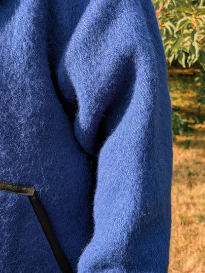 Close-up of a blue woolen texture of an upcycled blanket frontier jacket.
