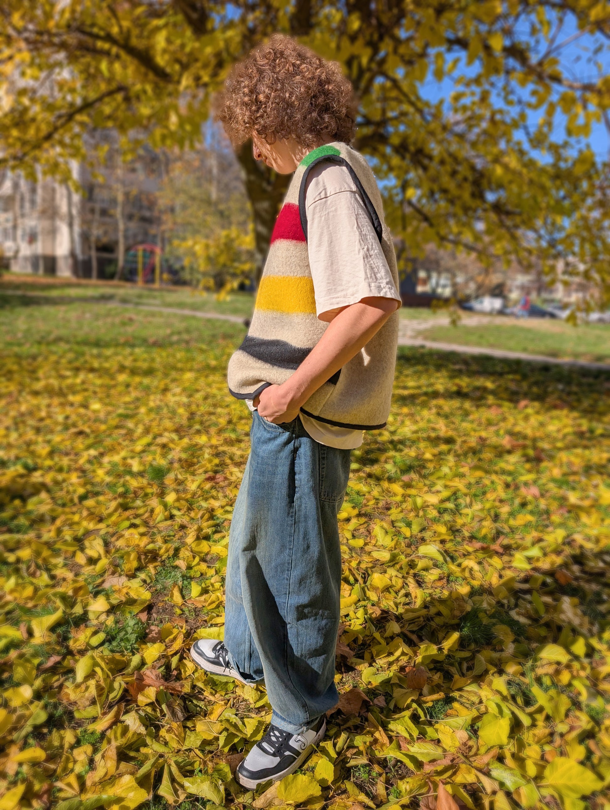 Man enjoying his cool modern multistriped vest, upcycled from a new wool blanket loomed locally traditional methods.