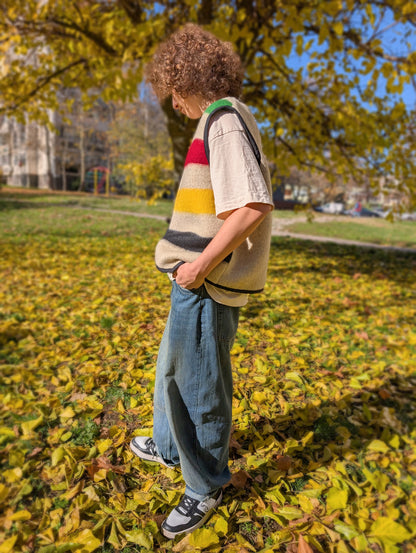 Man enjoying his cool modern multistriped vest, upcycled from a new wool blanket loomed locally traditional methods.