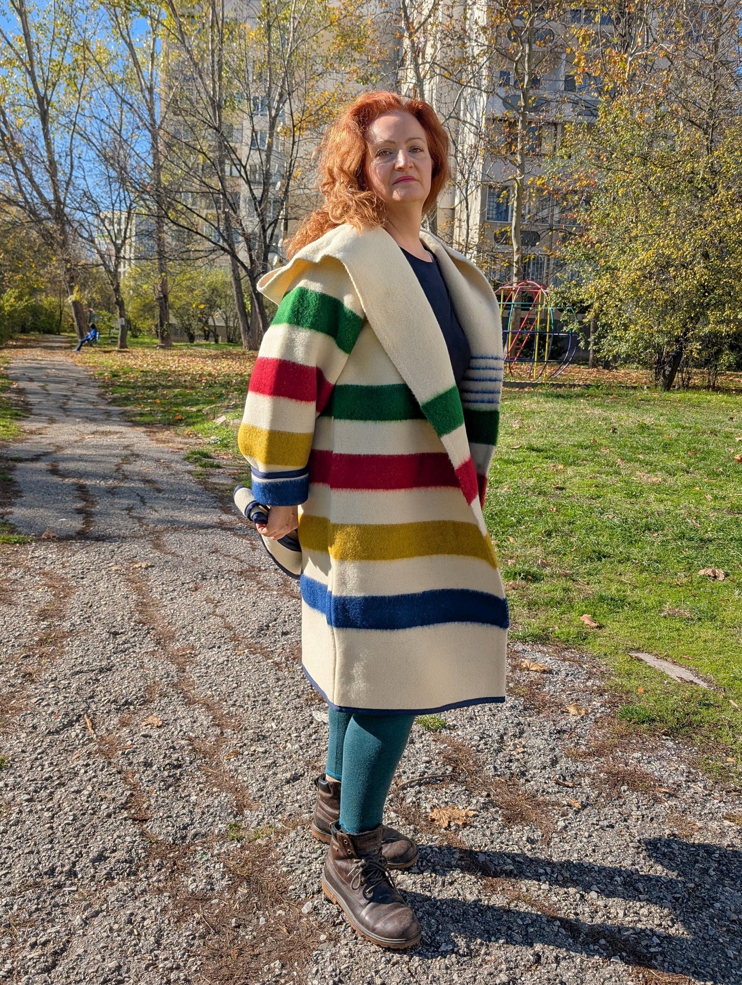 Ivory cozy midi wool robe coat with hood and belt, worn loose.
