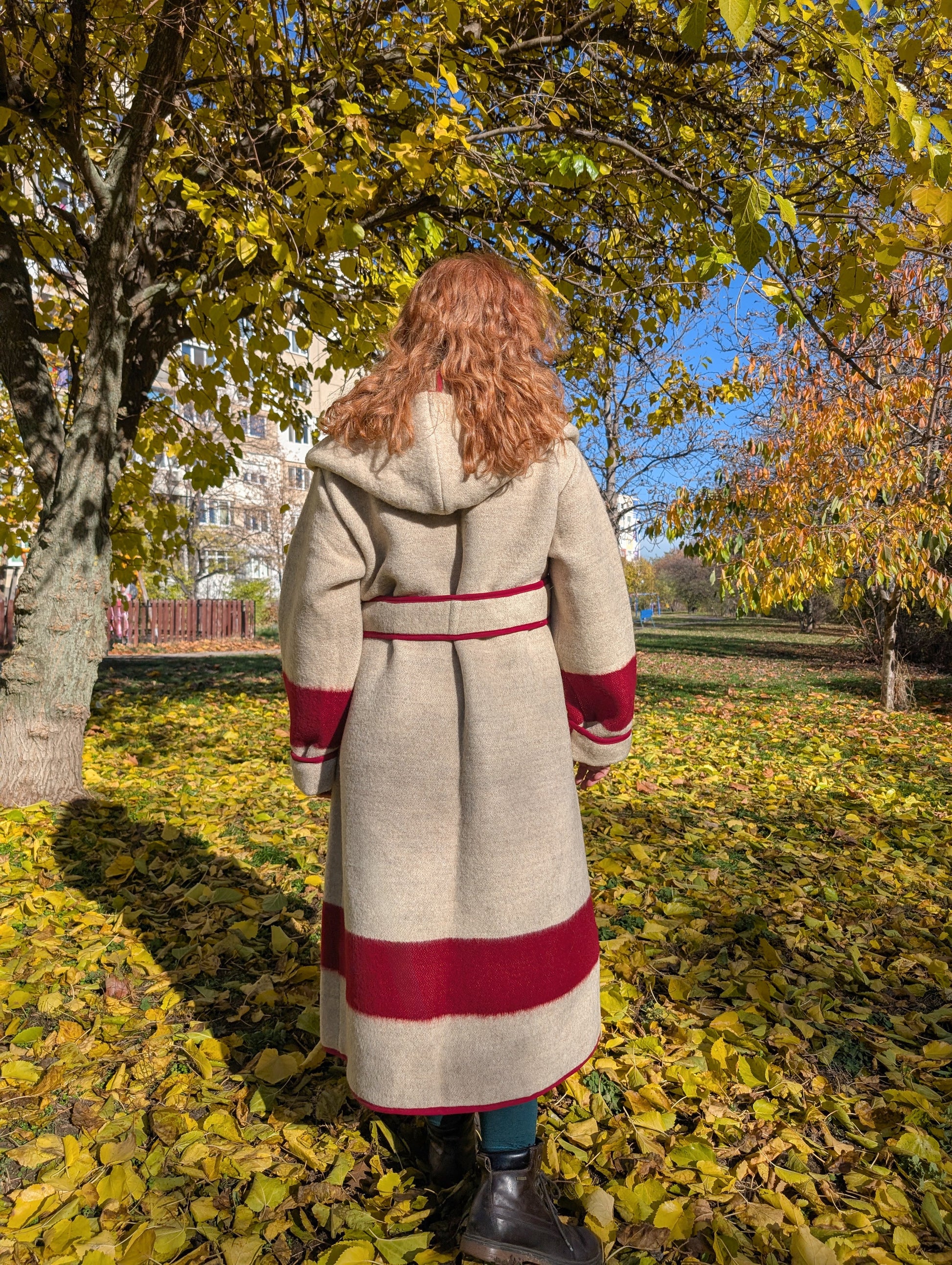 Long heavy first nations' wool wrap coat with red accents, made from artisan handmade pure wool blanket