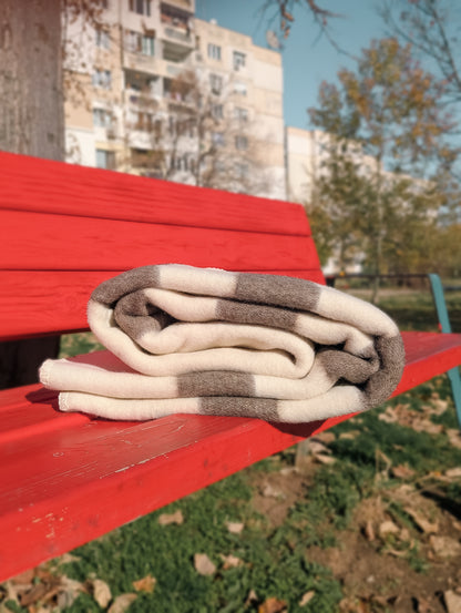 Folded wool striped throw woven from naturally colored Bulgarian wool