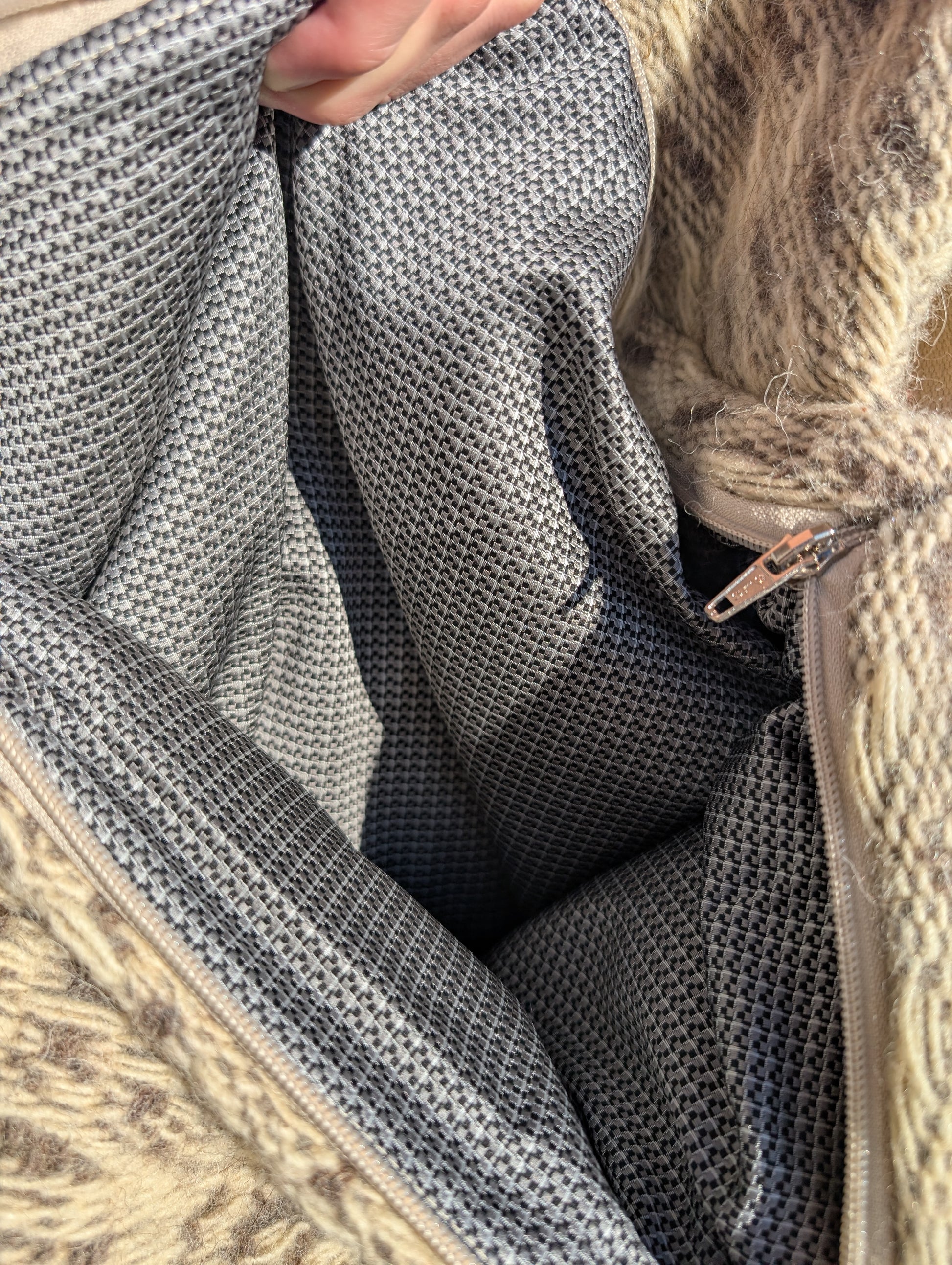 Close-up of stylish plaid satinated cotton lining.