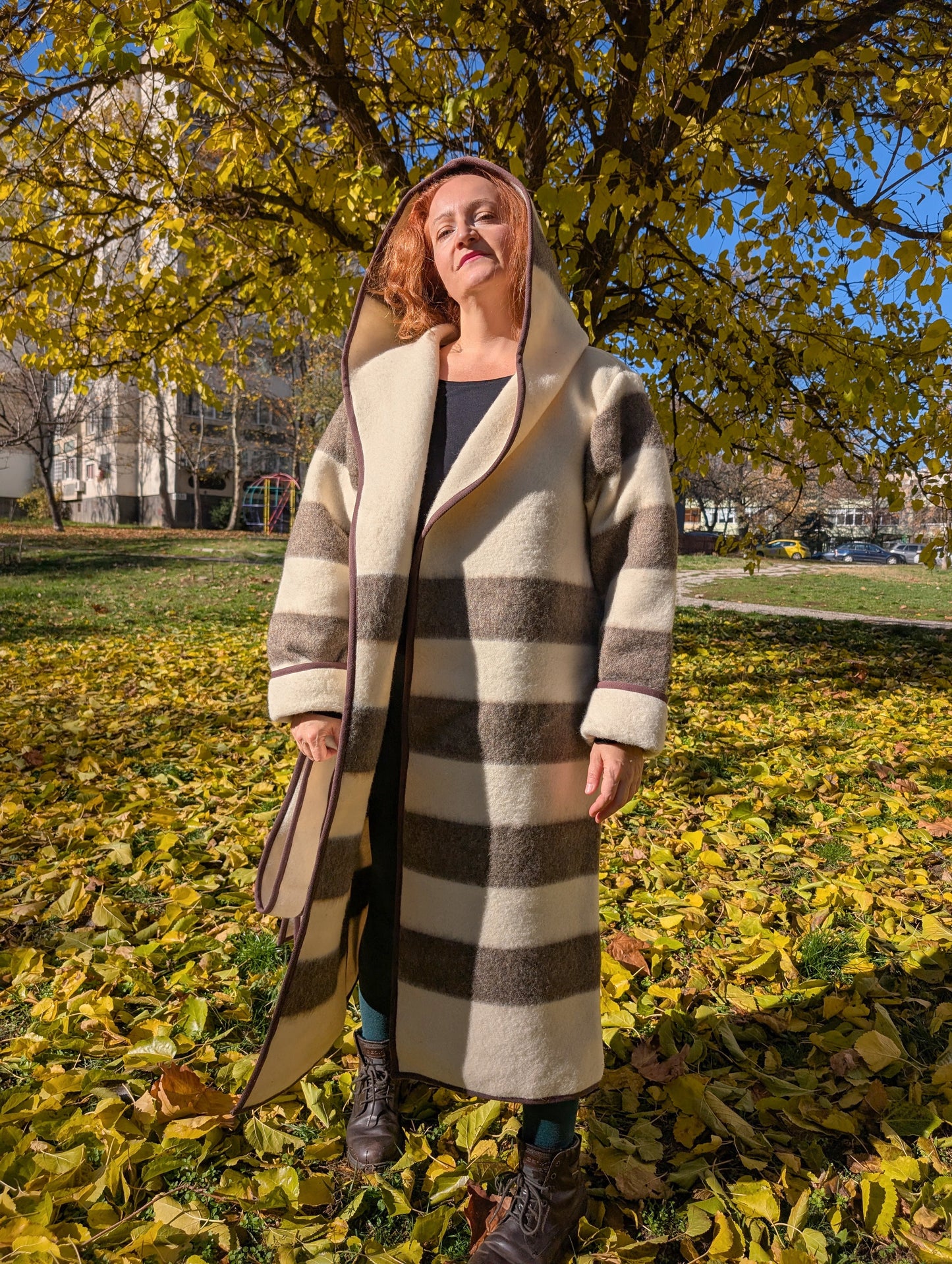Statement indigenous coat with natural beige and brown stripes, upcycled from a handwoven undyed wool blanket.