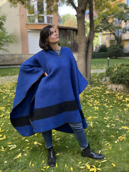 Person wearing an upcycled blue blanket poncho