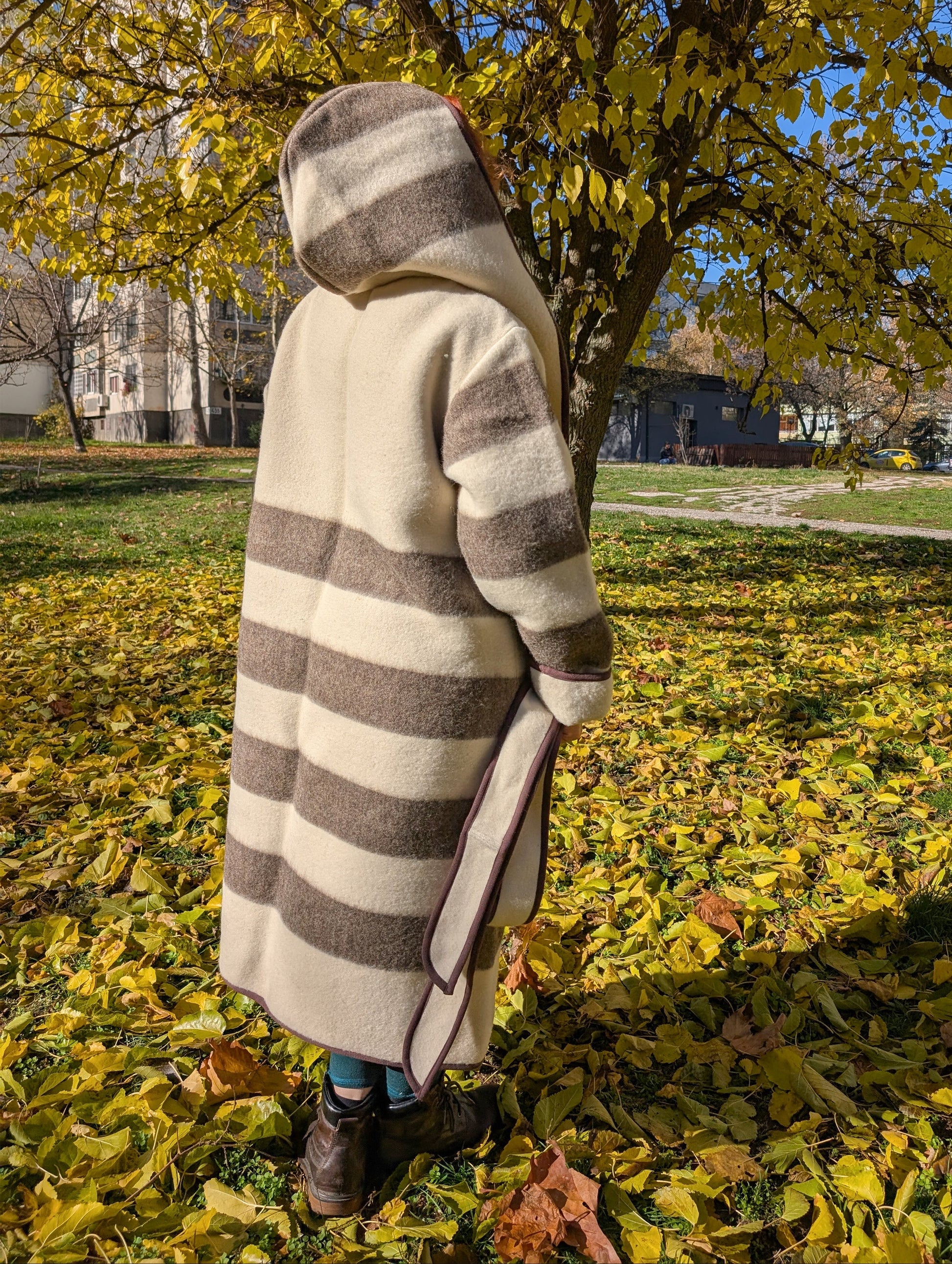 Warm, loose beige vintage coat with natural brown stripes and an optional belt, tailored from artisan handwoven pure wool blanket.