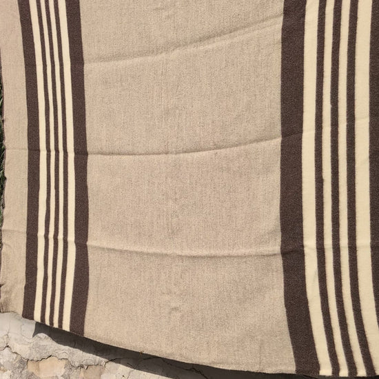01-video-gray-striped-blanket-earth-tones
